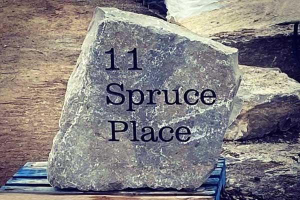Large address stone engraved with 11 Spruce Place