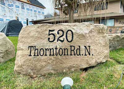 520 Thornton Rd. N. engraved on large rock
