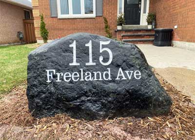 115 Freeland Ave Engraved on large rock